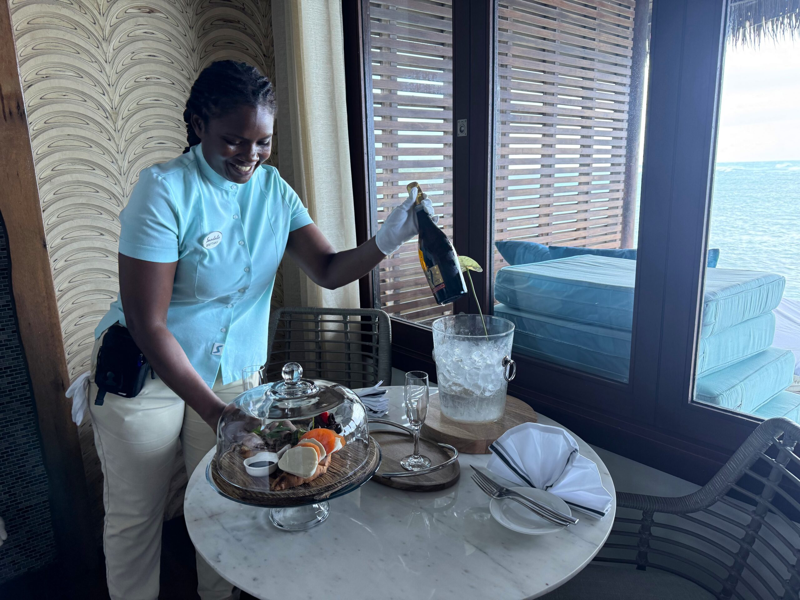Butler service with champagne and snack tray at the Overwater Private Island Butler Villa (OWV) at Sandals Caribbean Cay