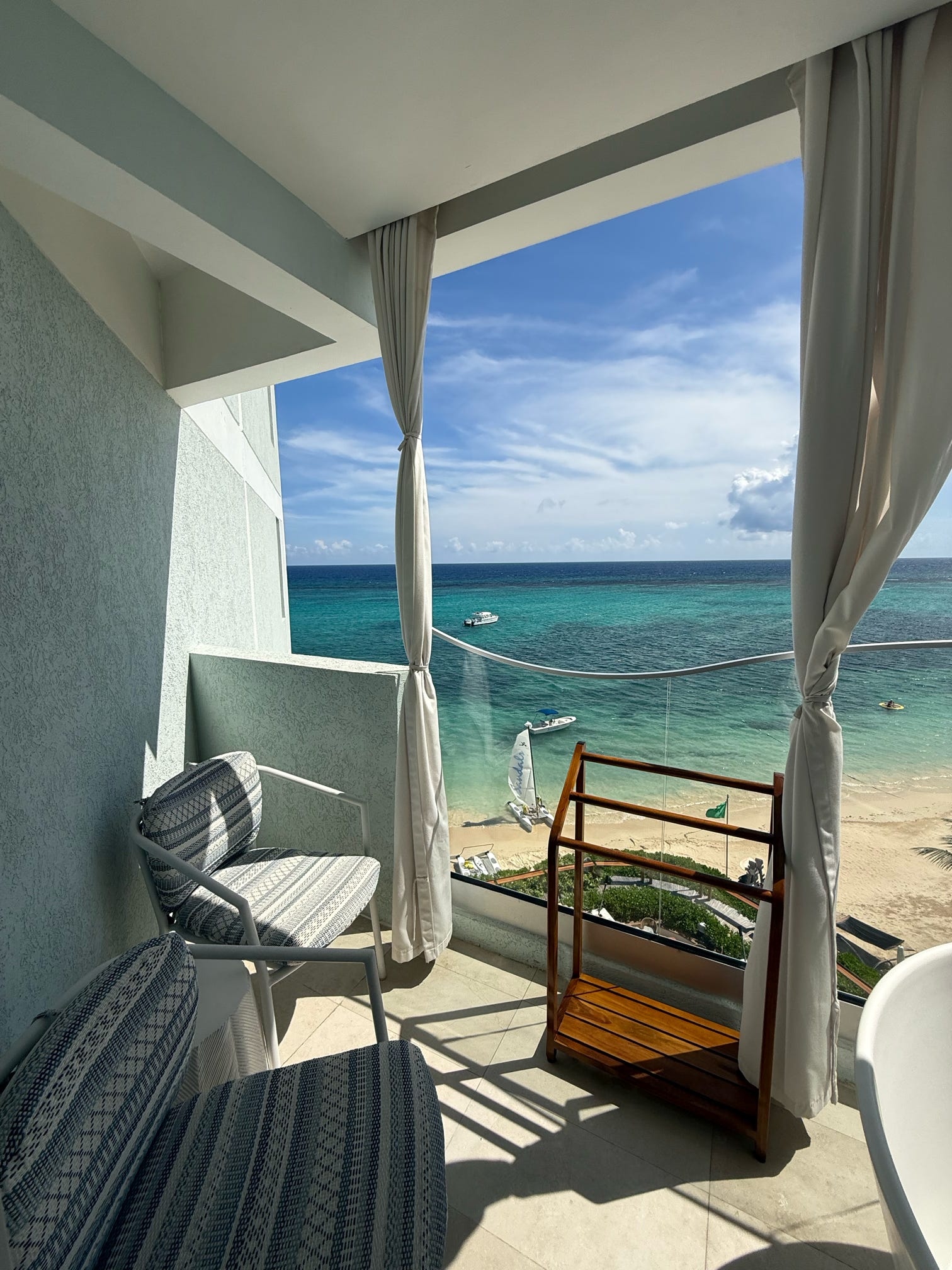 Private balcony overlooking the ocean and beach at the Mammee Bay Oceanview One Bedroom Butler Suite (O1B), Sandals Dunn's River