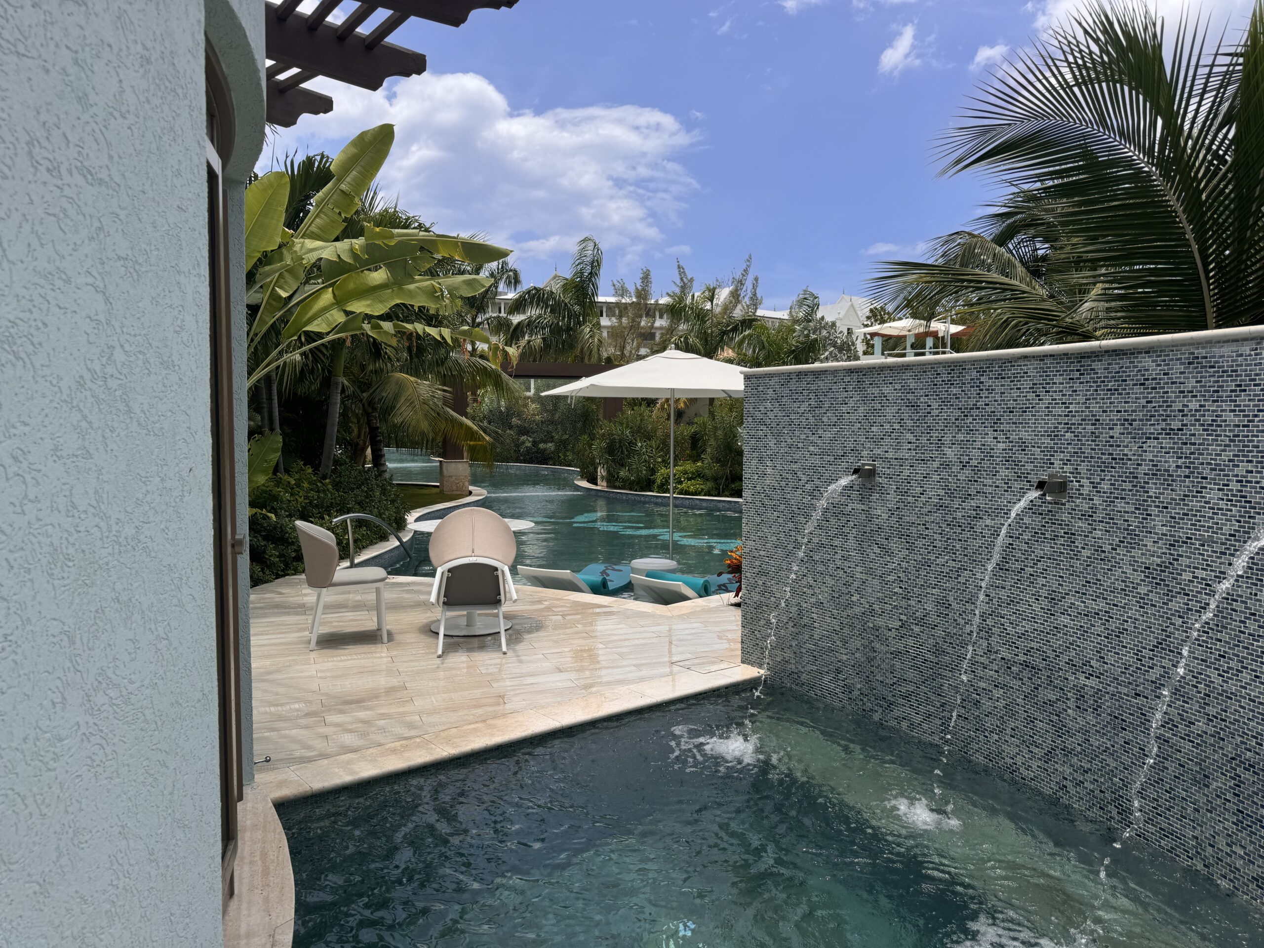 Private swim-up pool and shaded bistro table at the Coyaba Sky Villa Rondoval Butler Suite (SKYV) at Sandals Dunn's River
