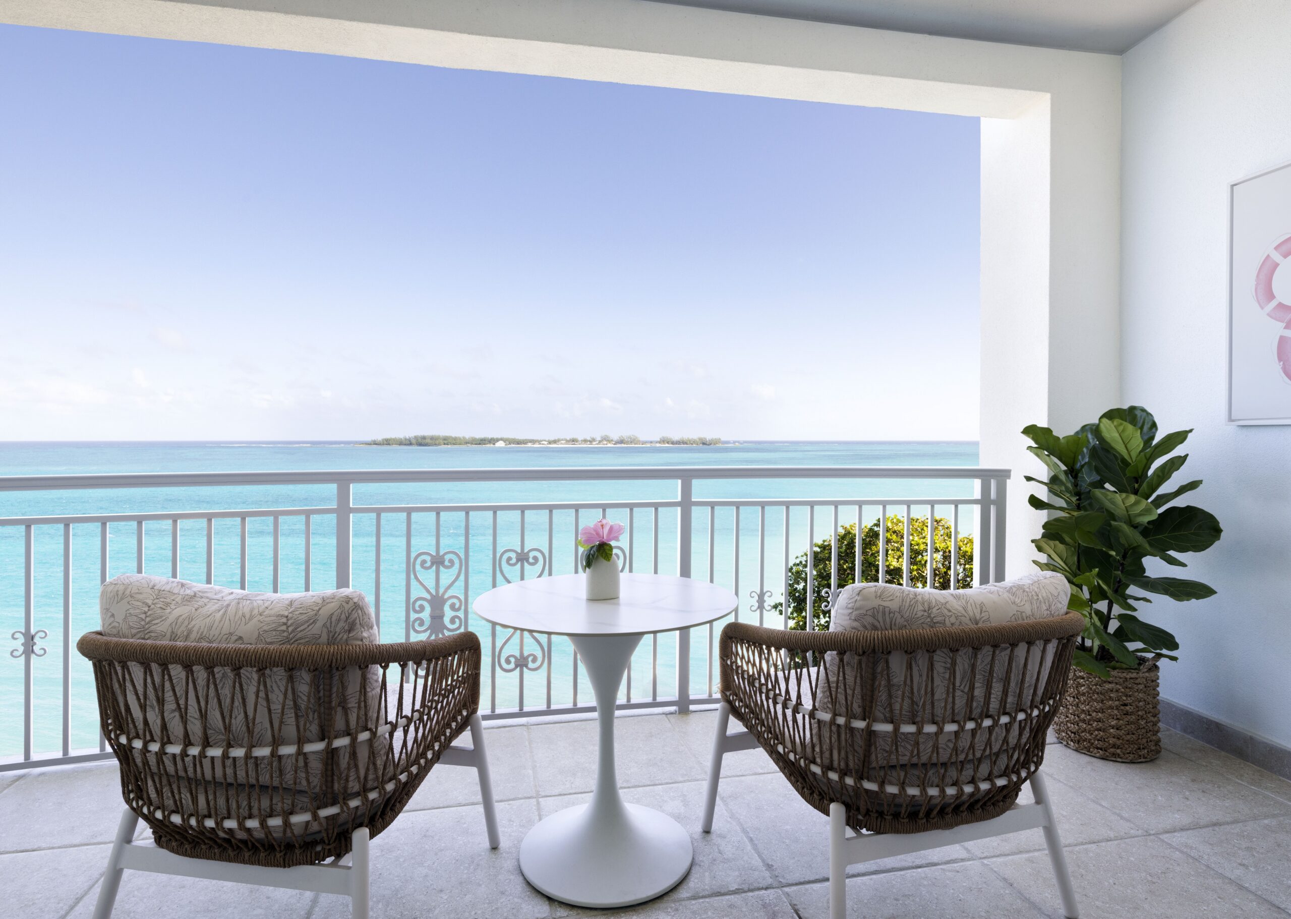 East Bay Beachfront Club Level Room balcony with direct ocean view at Sandals Royal Bahamian, a last-minute all-inclusive discount in the Bahamas