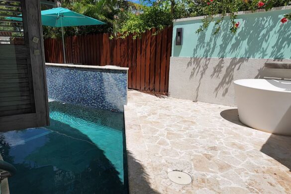 Private plunge pool and Tranquility soaking tub on the fenced patio of the South Seas Royal Rondoval Butler Suite (RPP) at Sandals Royal Barbados