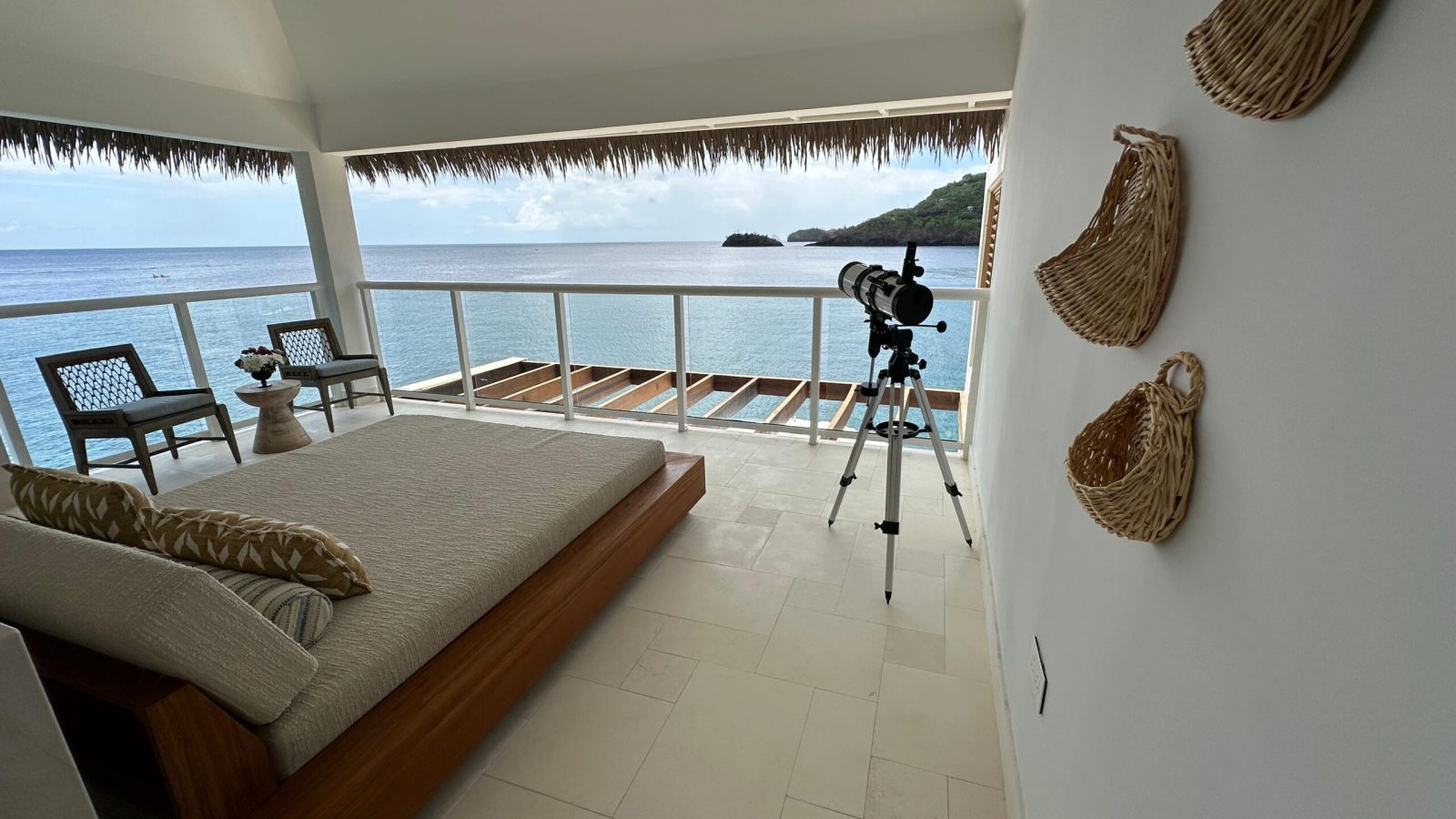 Vincy Overwater Two Story Villa (OWV) upstairs deck with day bed and telescope at Sandals Saint Vincent