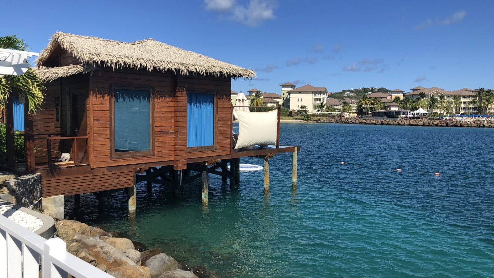 Sandals Grande St. Lucian Overwater Honeymoon Butler Bungalow (OWB) with glass floor panels and over-water hammock