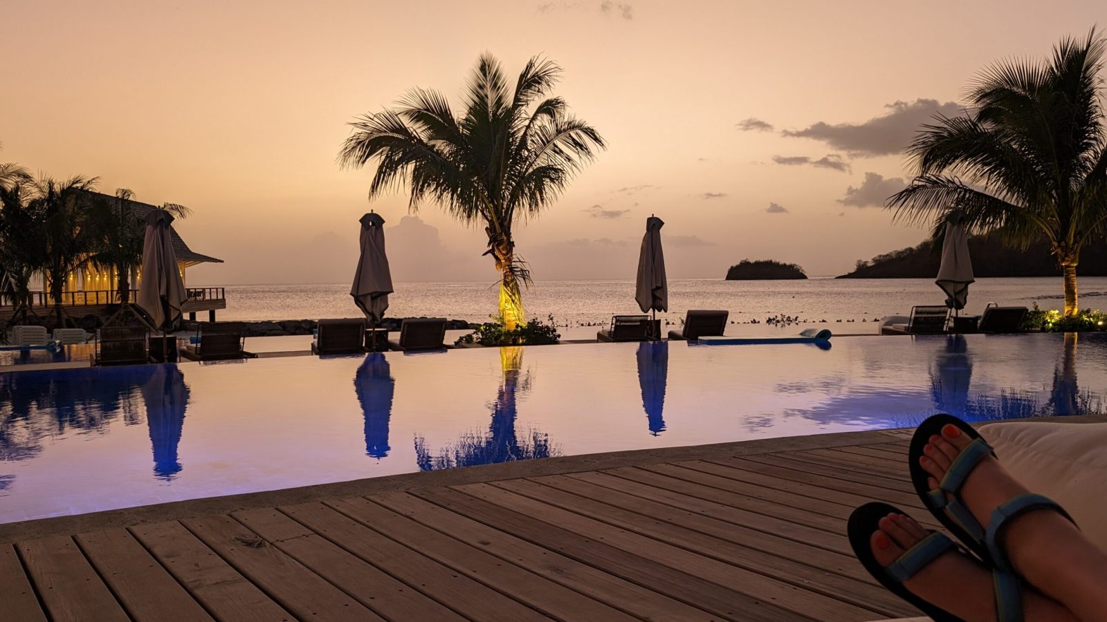Sunset at the infinity pool near the overwater villas at Sandals Saint Vincent