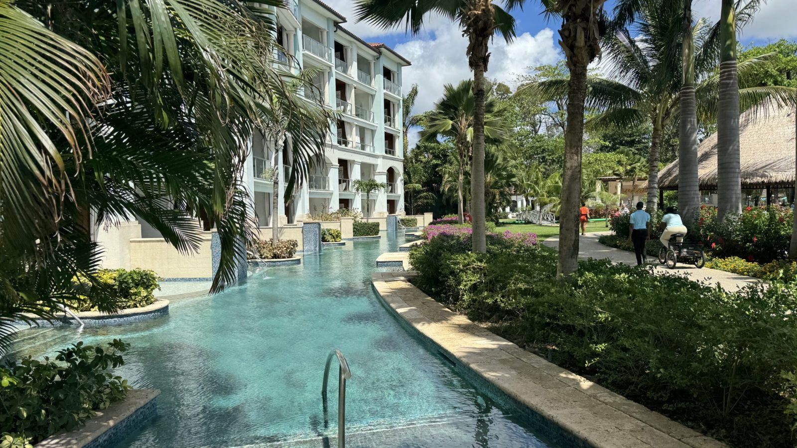 View along the Crystal Lagoon swim-up pool at Sandals Royal Barbados showing the line of 1SUP butler suite patios