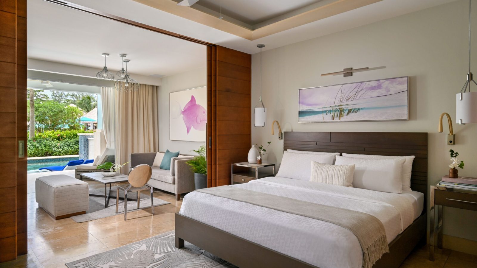 Sandals Royal Barbados Crystal Lagoon Swim-Up Butler Suite interior showing bedroom, living area, and patio pool beyond