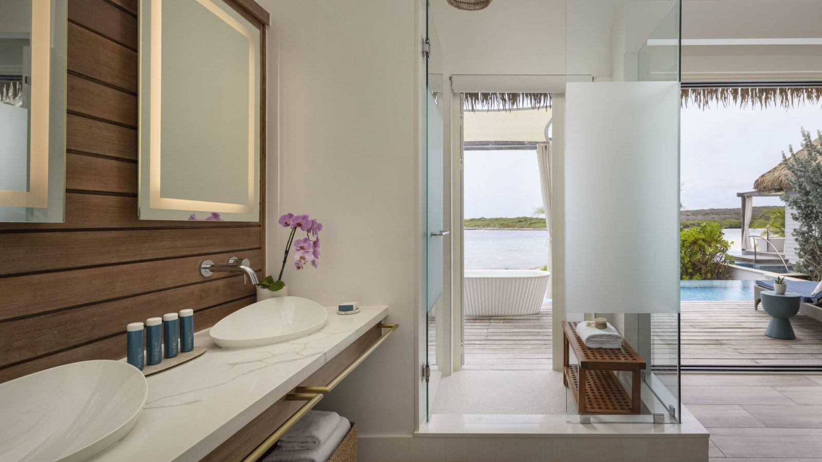 The walk-in rain shower in the Awa Seaside Bungalow at Sandals Royal Curaçao, accessible from both the patio and the interior of the bungalow.