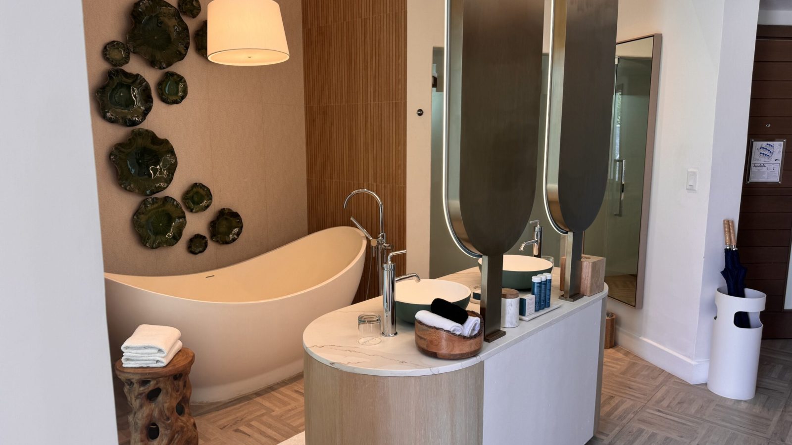 Bathroom in the Coyaba Sky Villa Rondoval Butler Suite (SKYV) at Sandals Dunn's River, with a freestanding soaking tub and double vanity