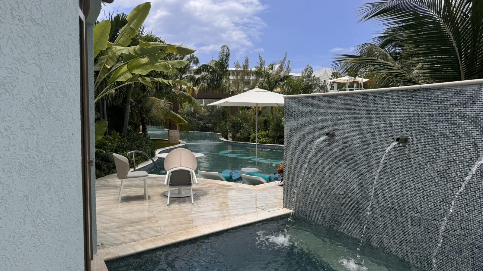 Private swim-up pool and shaded bistro table at the Coyaba Sky Villa Rondoval Butler Suite (SKYV) at Sandals Dunn's River