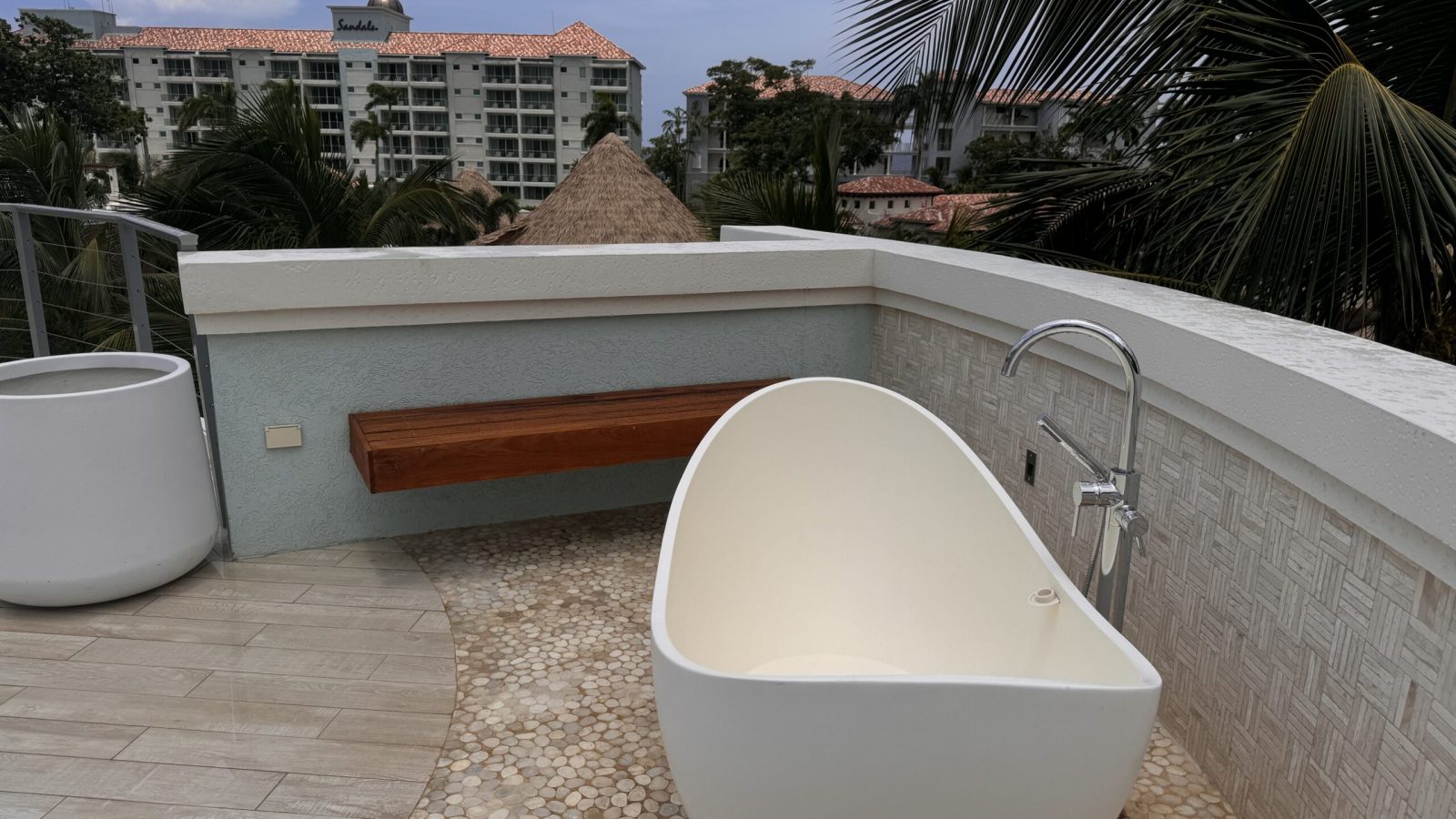 Rooftop deck with an outdoor soaking tub at the Coyaba Sky Villa Rondoval Butler Suite (SKYV) at Sandals Dunn's River