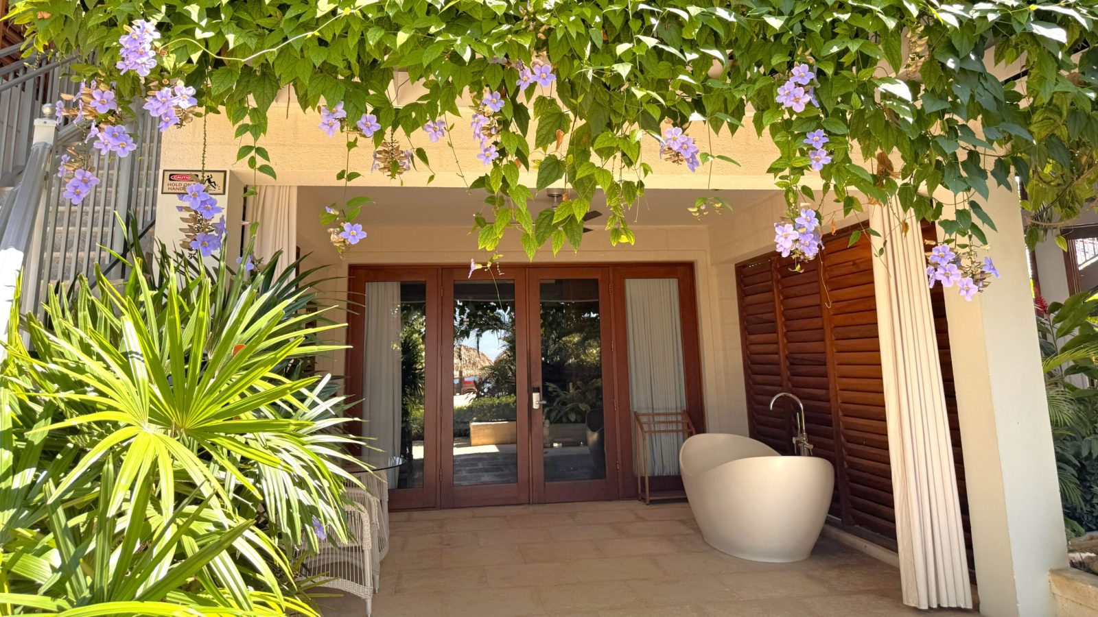 Sandals Montego Bay Romeo and Juliet Butler Suite main entrance with flowers on the patio