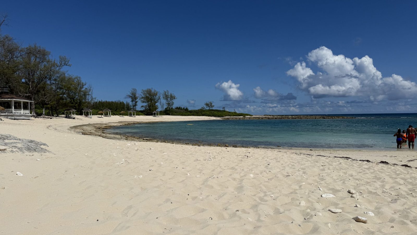 Quiet white sand cove with turquoise water on Sandals Barefoot Cay at Sandals Royal Bahamian