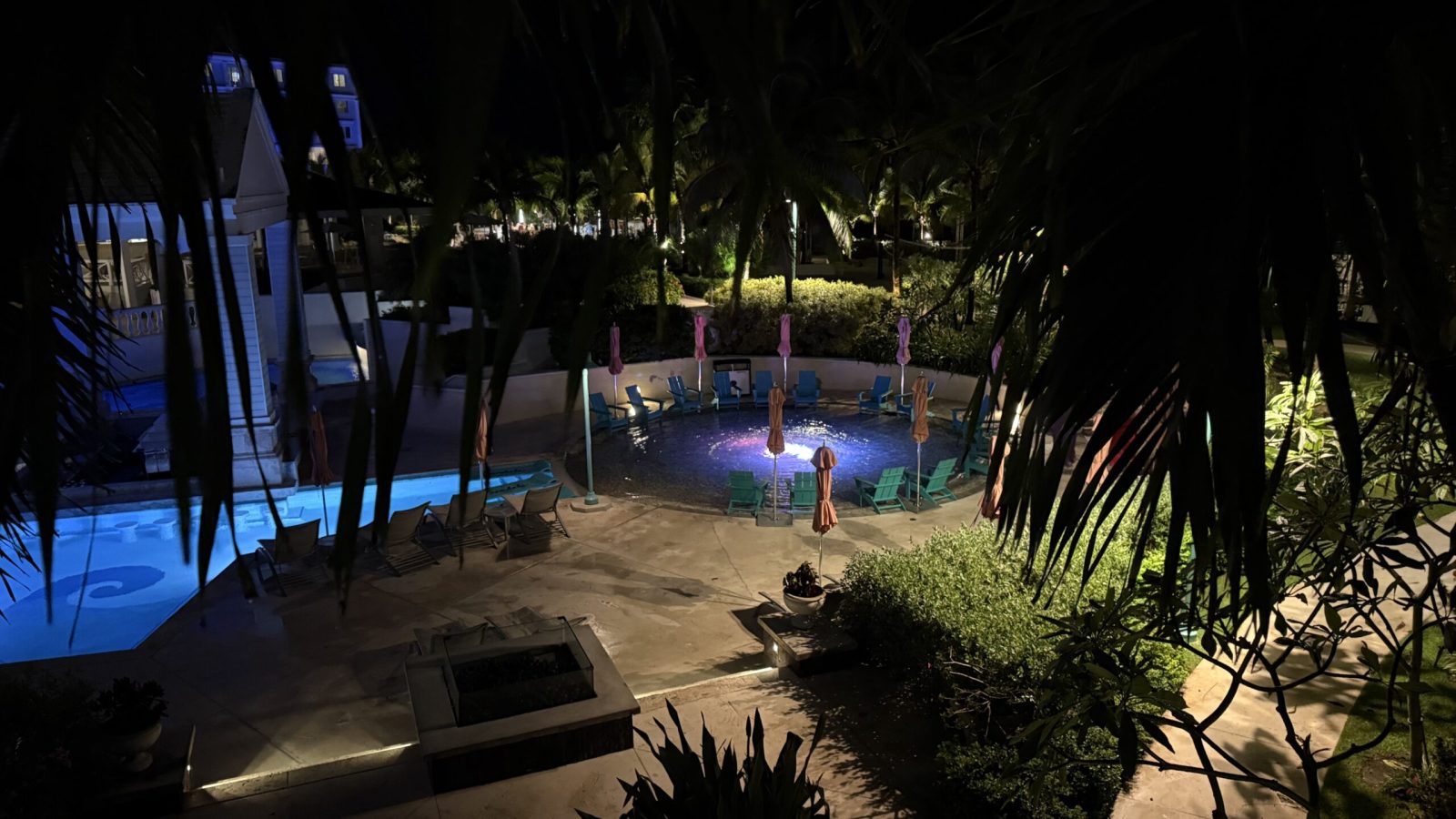 Nighttime view from Sandals Royal Bahamian East Bay Honeymoon Oceanview Club Level Room balcony looking down at hot tub