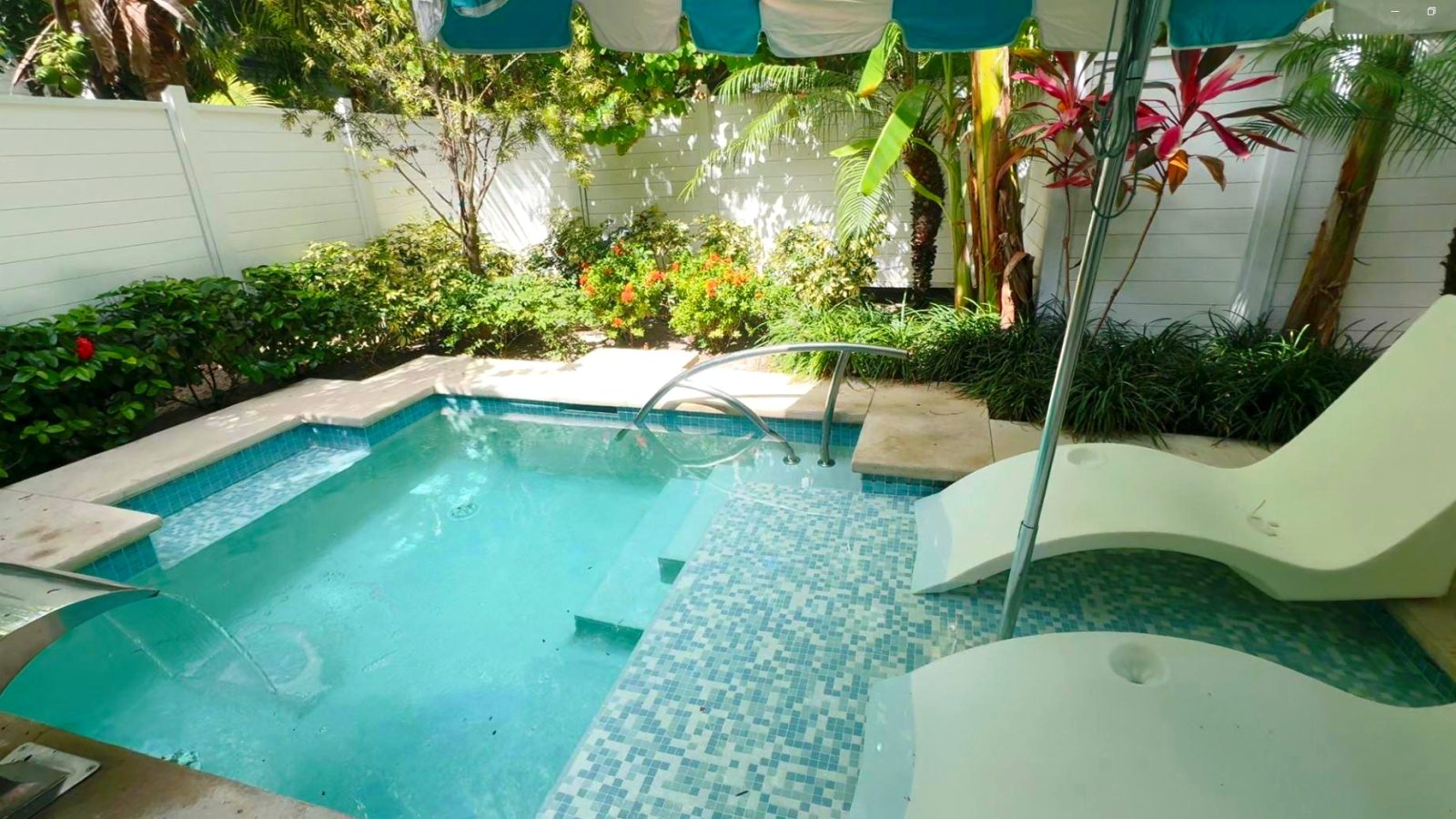 Private plunge pool with in-water loungers at the Island Village One Bedroom Butler Villa Suite (V1PP) at Sandals Royal Bahamian