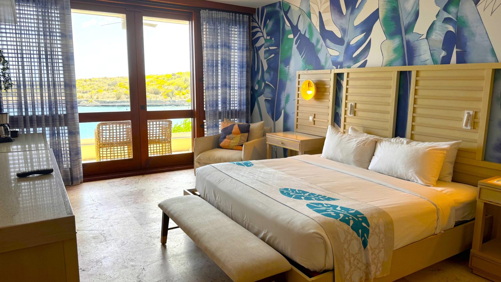 Sandals Royal Curaçao Sunchi Beachside Club Level Room hallway entry looking toward king bed and balcony sliding glass doors